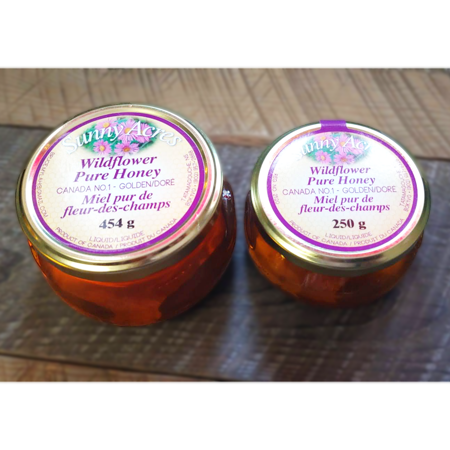 large and small jars wildflower liquid honey
