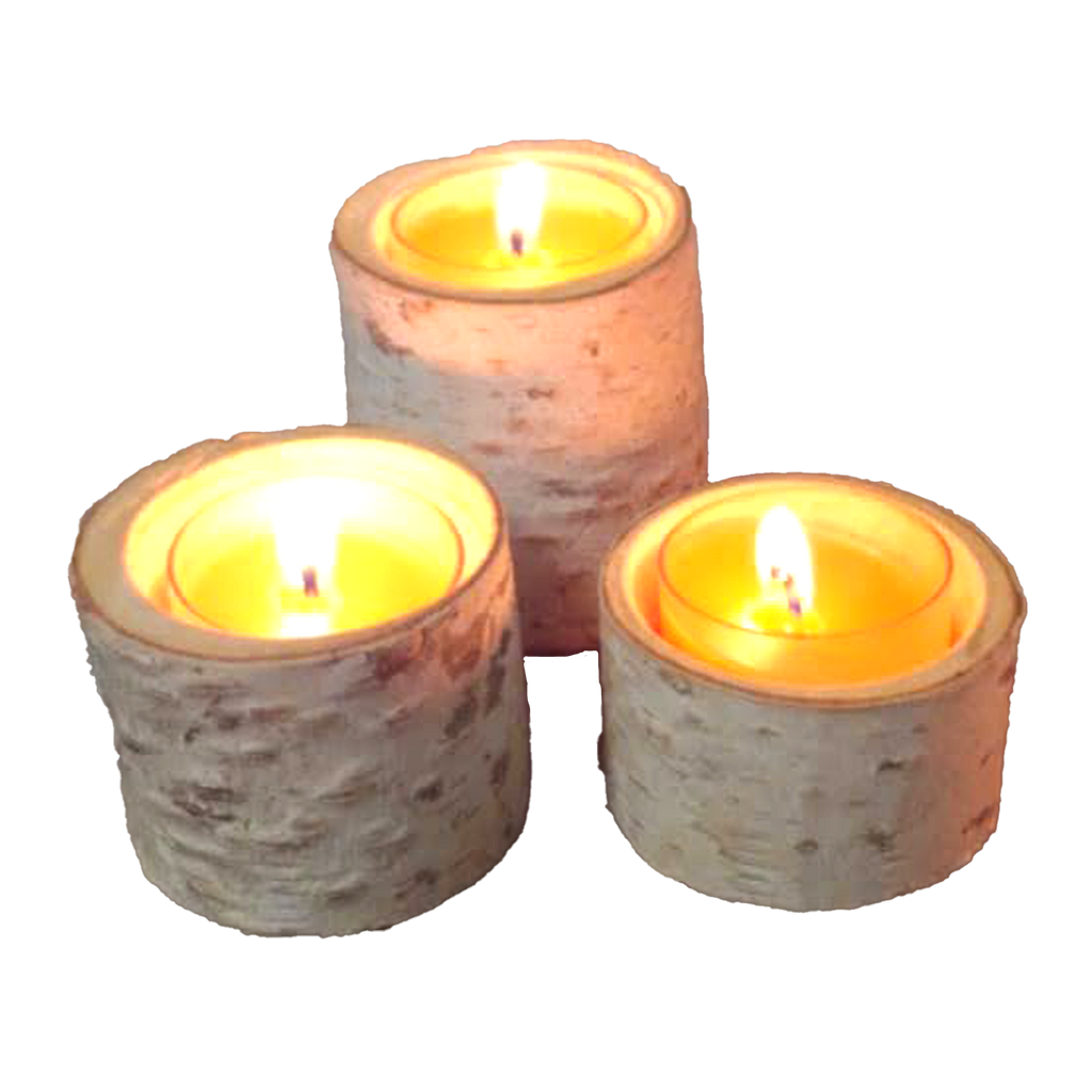 3 tealights burning in birch candle holders