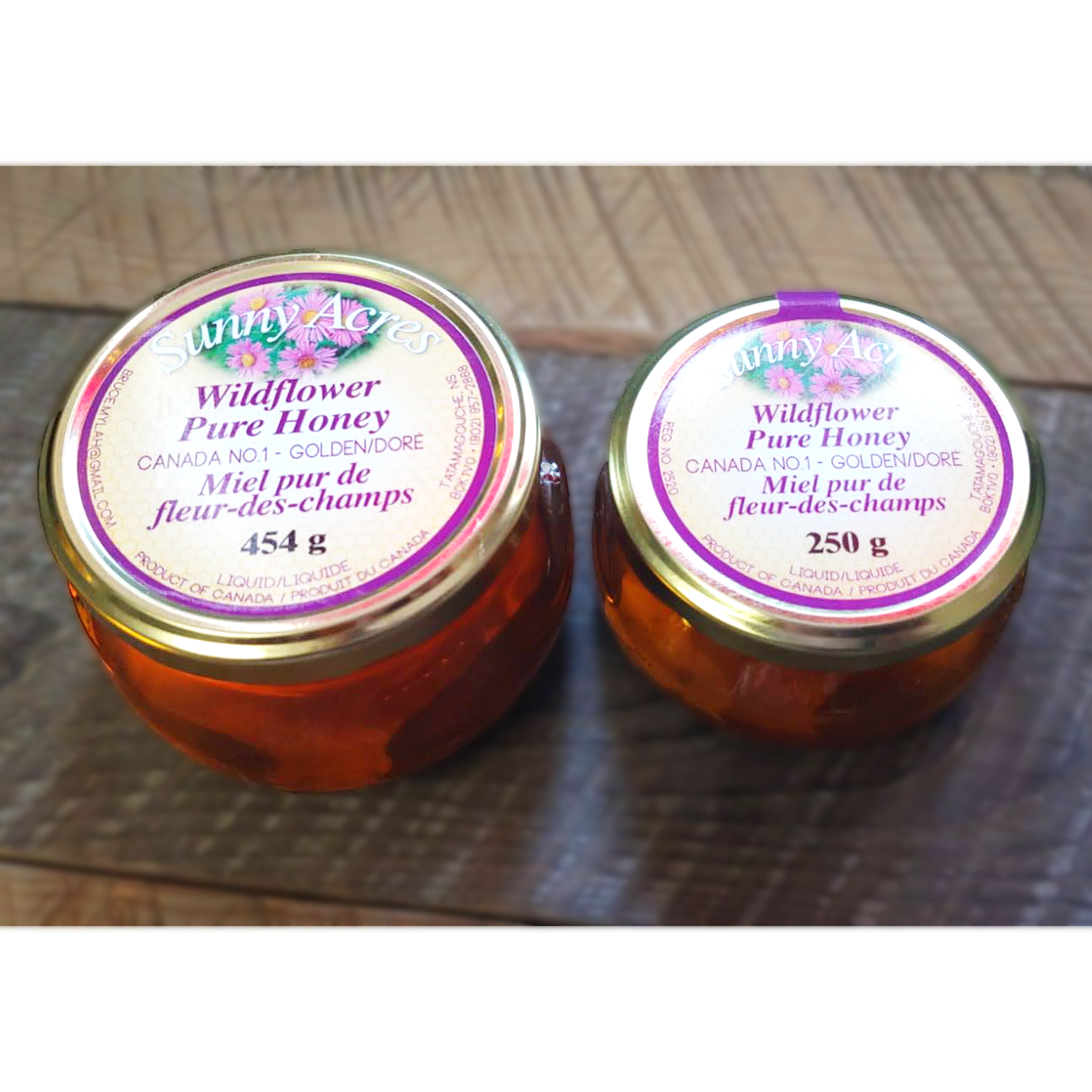 large and small jars wildflower liquid honey